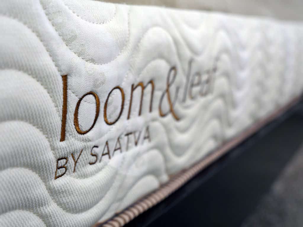 Ultra close up shot of the Loom & Leaf mattress logo