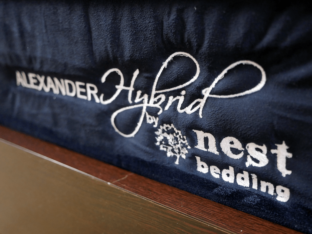 Close up shot of the Nest Alexander hybrid logo