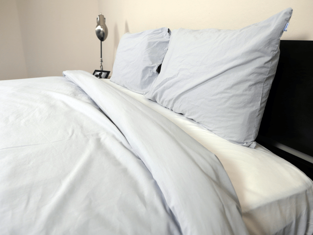 Close up of the bedface sheet sets, showing duvet, pillows, and fitted sheet