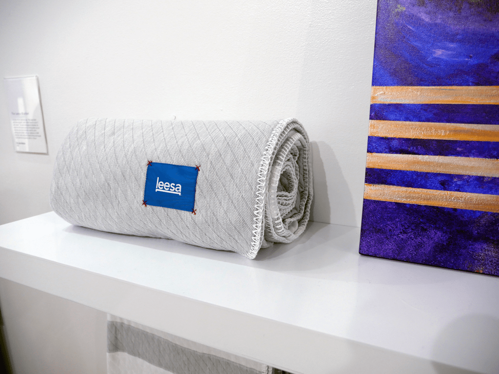 The newly released Leesa blanket is showcased next to a piece of art at their new Dream Gallery