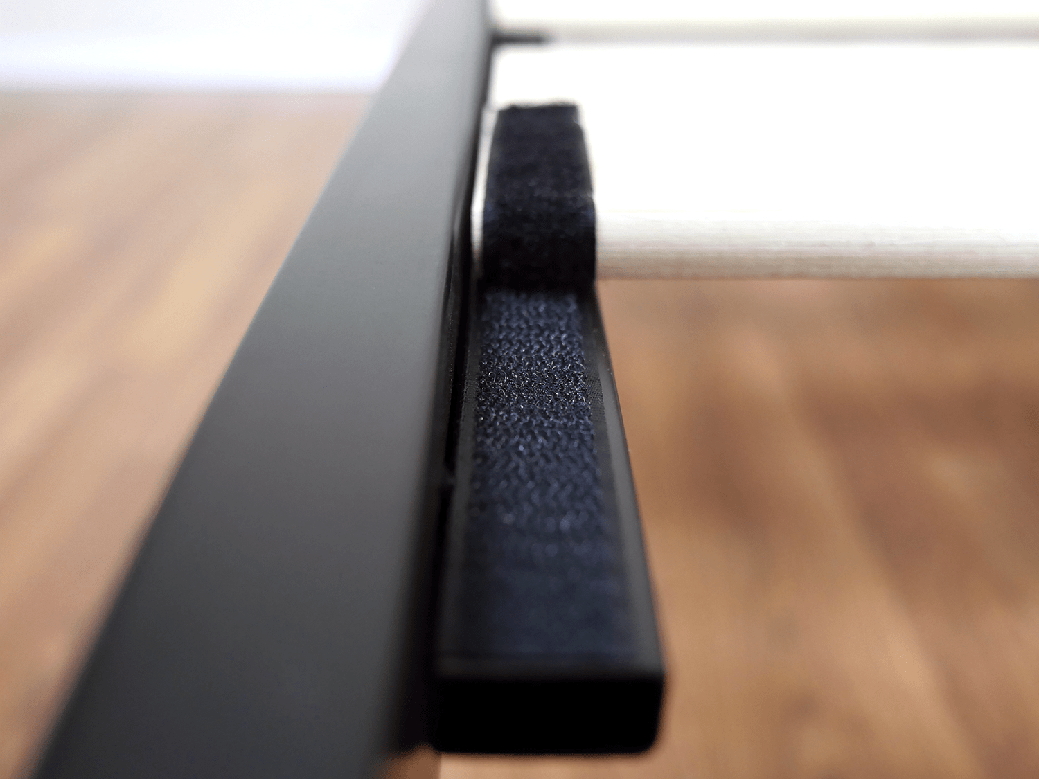 Close up shot of the velcro straps used to secure the wood on the Zinus platform bed