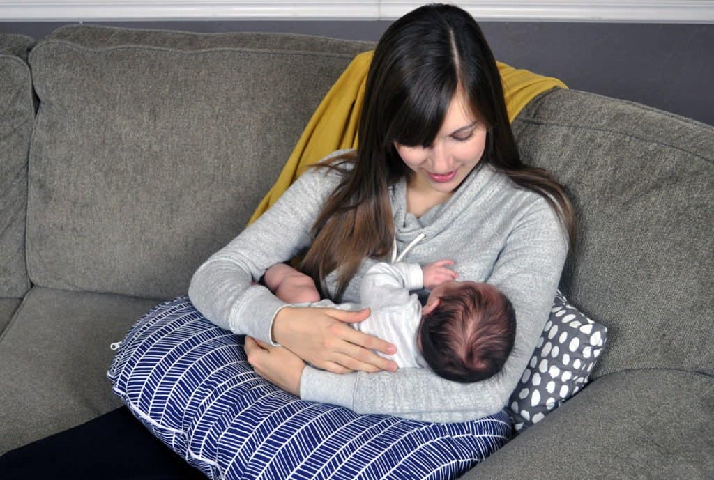 Kayla & Graham testing out the Boppy nursing pillow