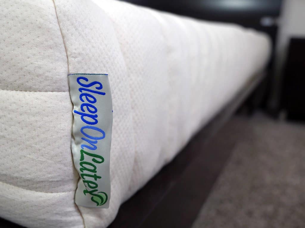 Ultra close up shot of the SleepOnLatex mattress logo
