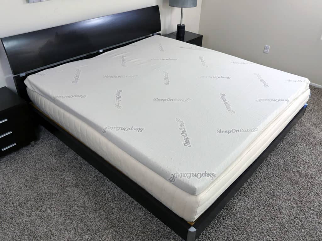 Sleep On latex mattress topper on bed