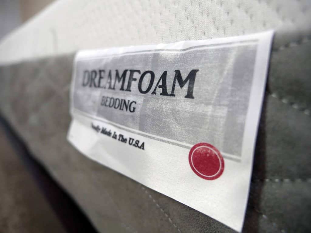 Ultra close up shot of the Ultimate Dreams Supreme Gel mattress logo