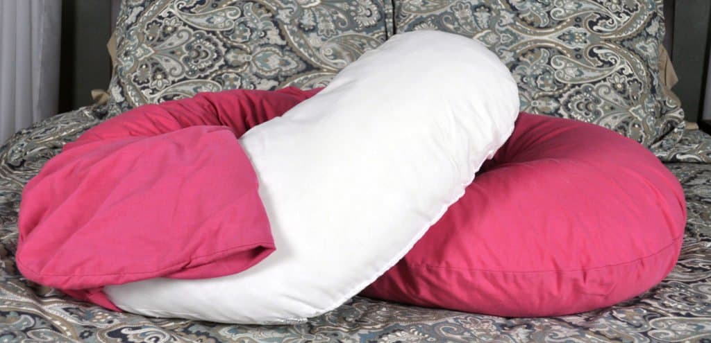 Snoogle pillow with the cover partially removed
