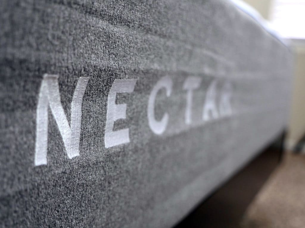 Ultra close up shot of the Nectar mattress logo