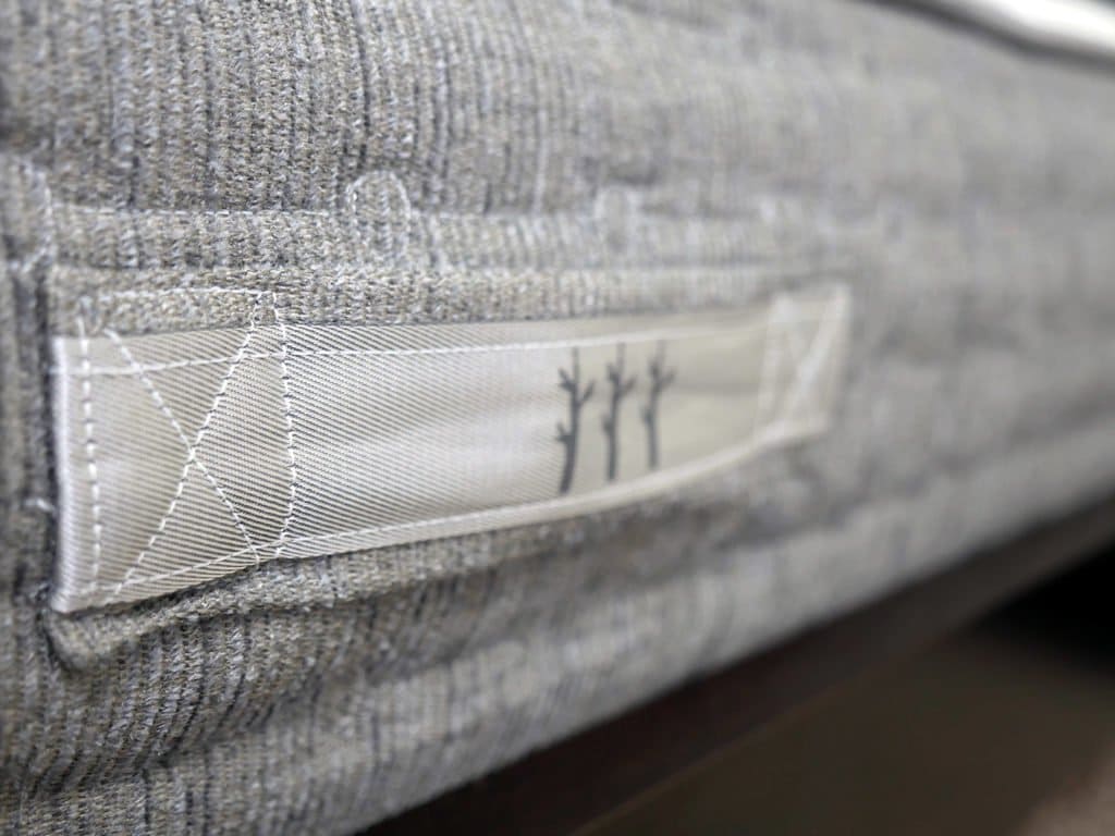 Ultra close up shot of the handles affixed to the cover of the Sierra mattress