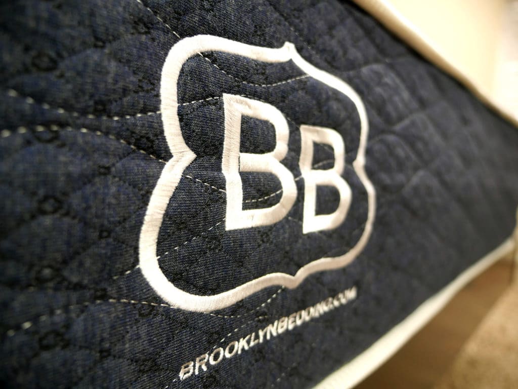 Ultra close up shot of the Brooklyn Bedding logo