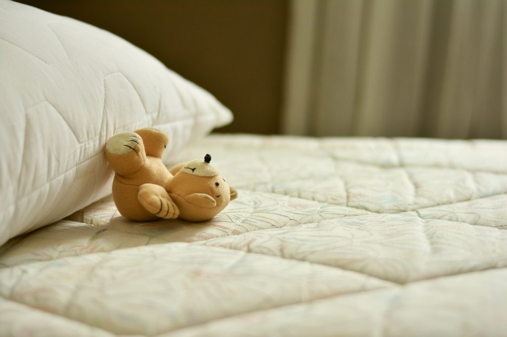 baby sleeping on soft mattress