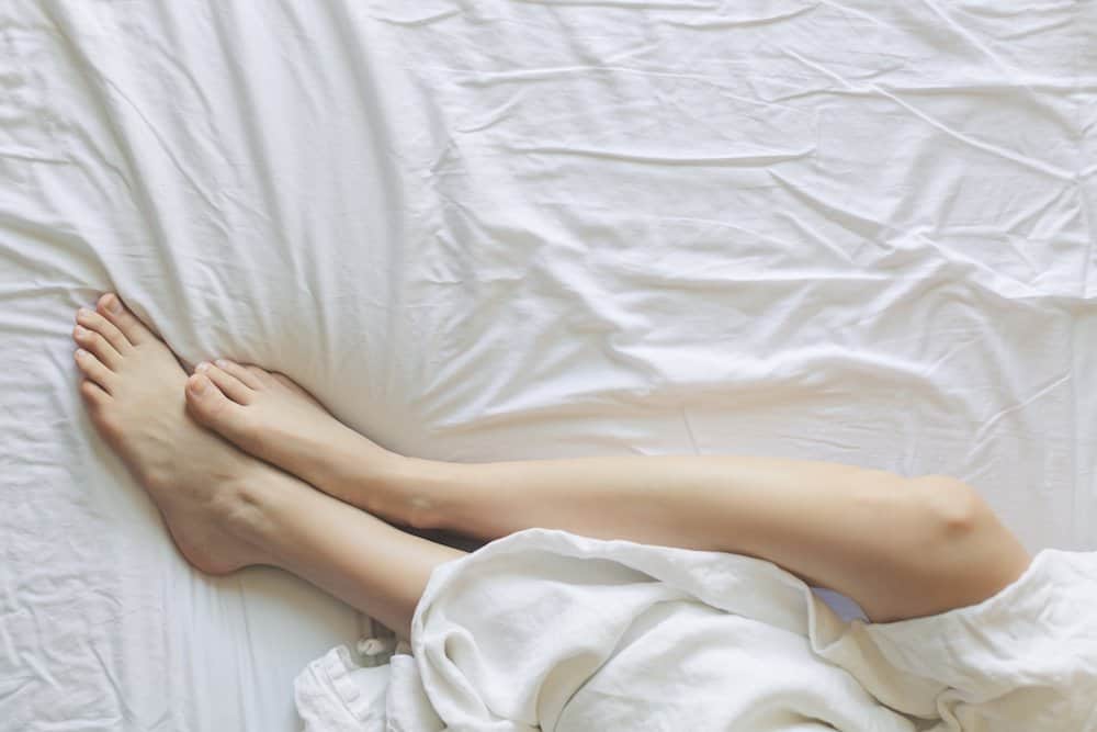 lower legs shown in bed