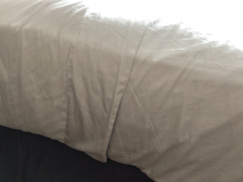 Parachute Sateen Sheets tucked under mattress