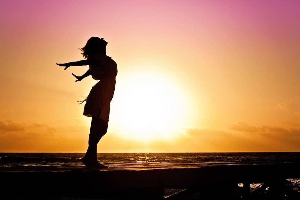 woman happiness sunrise silhouette 40192