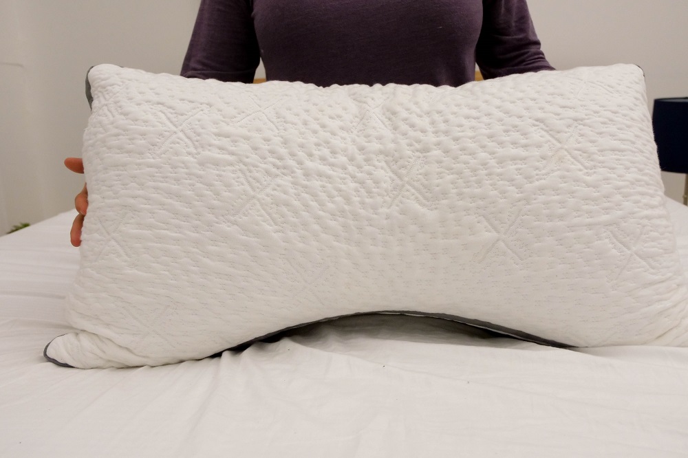 Holding the Easy Breather Side Sleeper pillow 