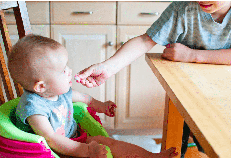 Feeding your baby solids early may help them sleep, study suggests