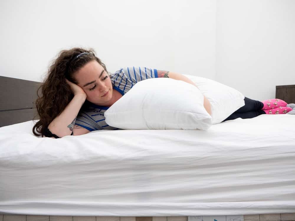 Side holding the Sleepgram pillow 