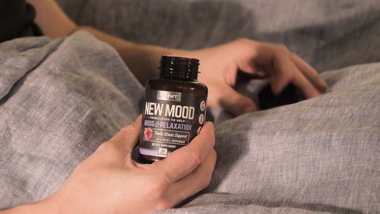 Open bottle of Omit New Mood supplement 