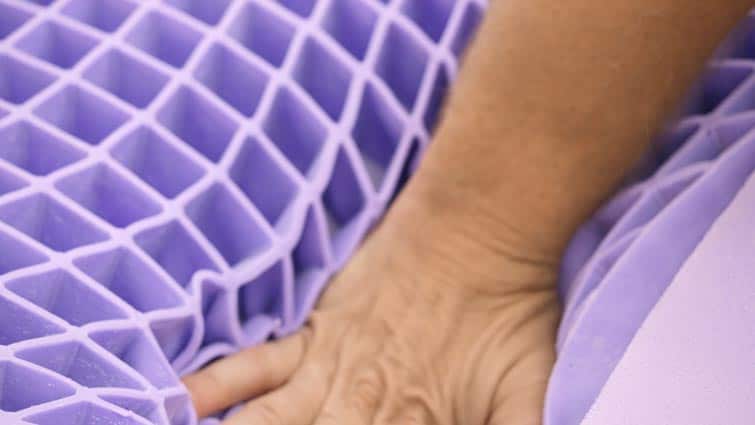 https://sleepopolis.com/wp-content/uploads/2019/10/Purple-Mattress-Pressing-in.jpg