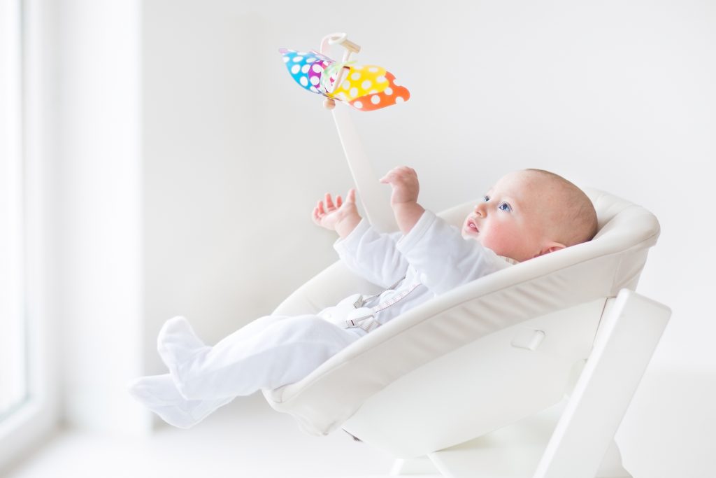 baby on angled bed