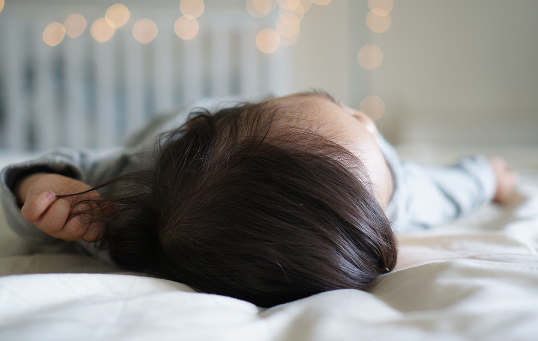 baby sleeping in bed