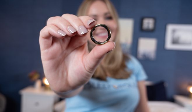 Holding up the Oura ring.