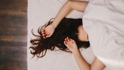 Woman sleeping under the covers
