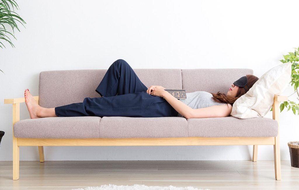 woman sleeping on couch