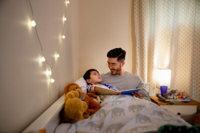 parent reading a book with child