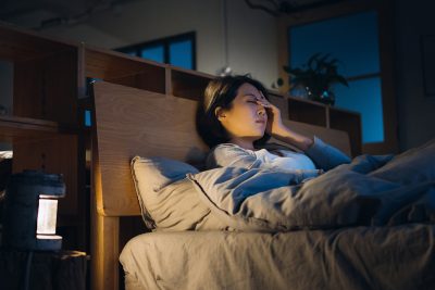 woman in bed wondering what to do when you didn't sleep all night