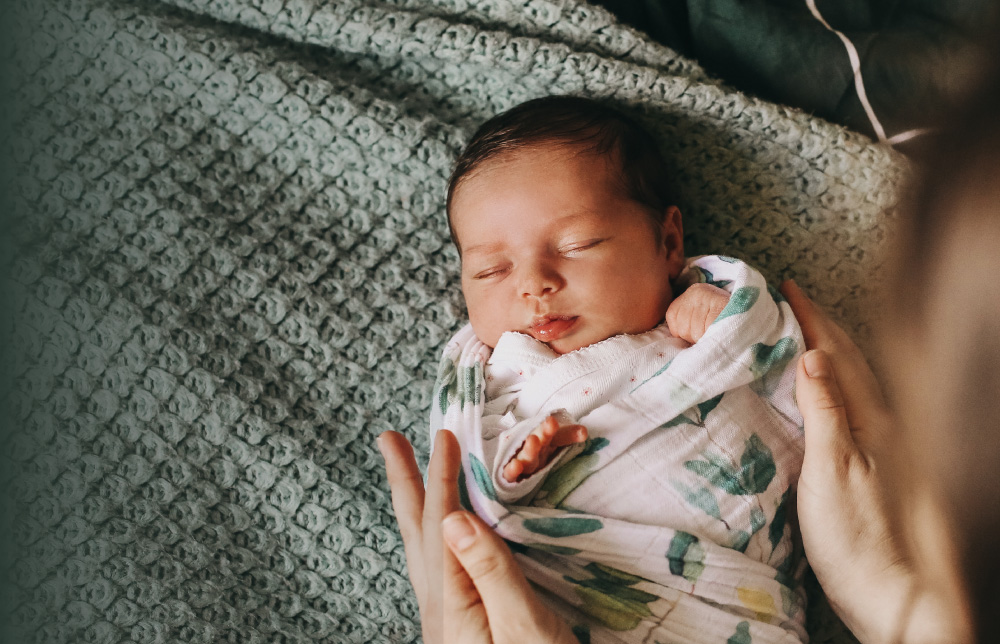 baby sleeping in a sleep sac