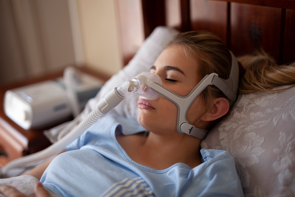 cpap machine woman sleeping