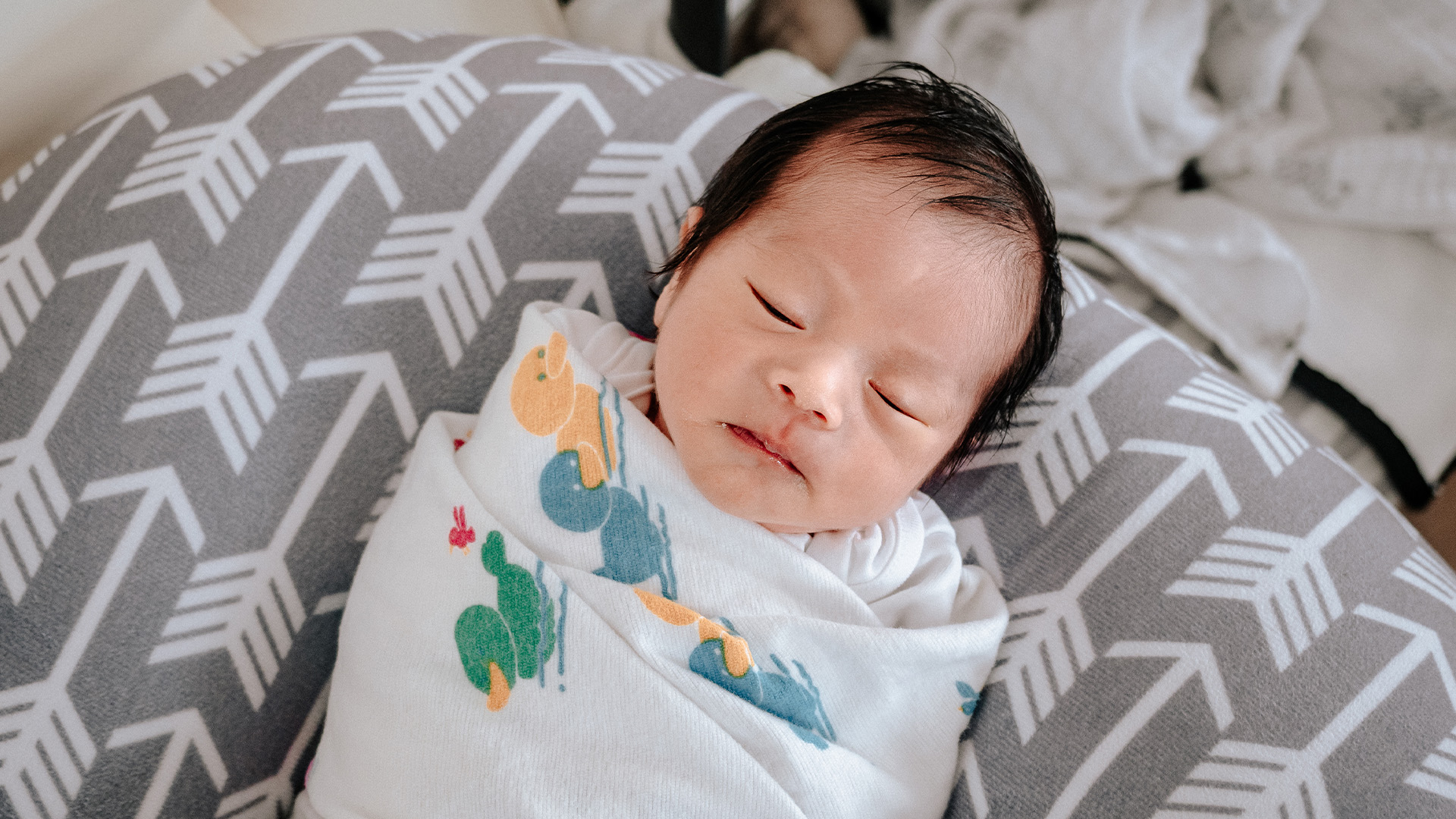 Baby sleeping in cheap boppy pillow