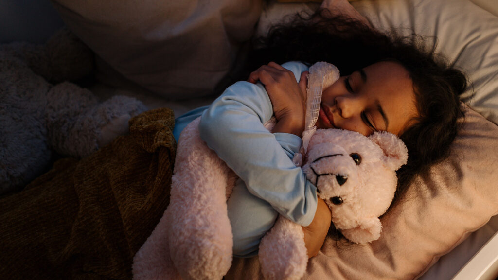 child sleep with teddy bear