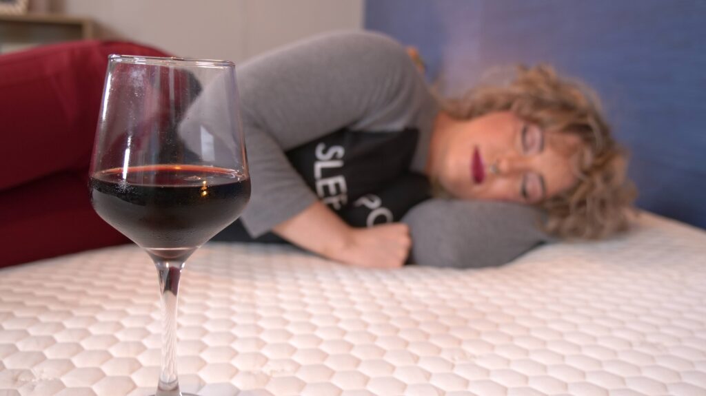 Nichole doing the wine test on the Brooklyn Bedding Aurora Luxe Mattress