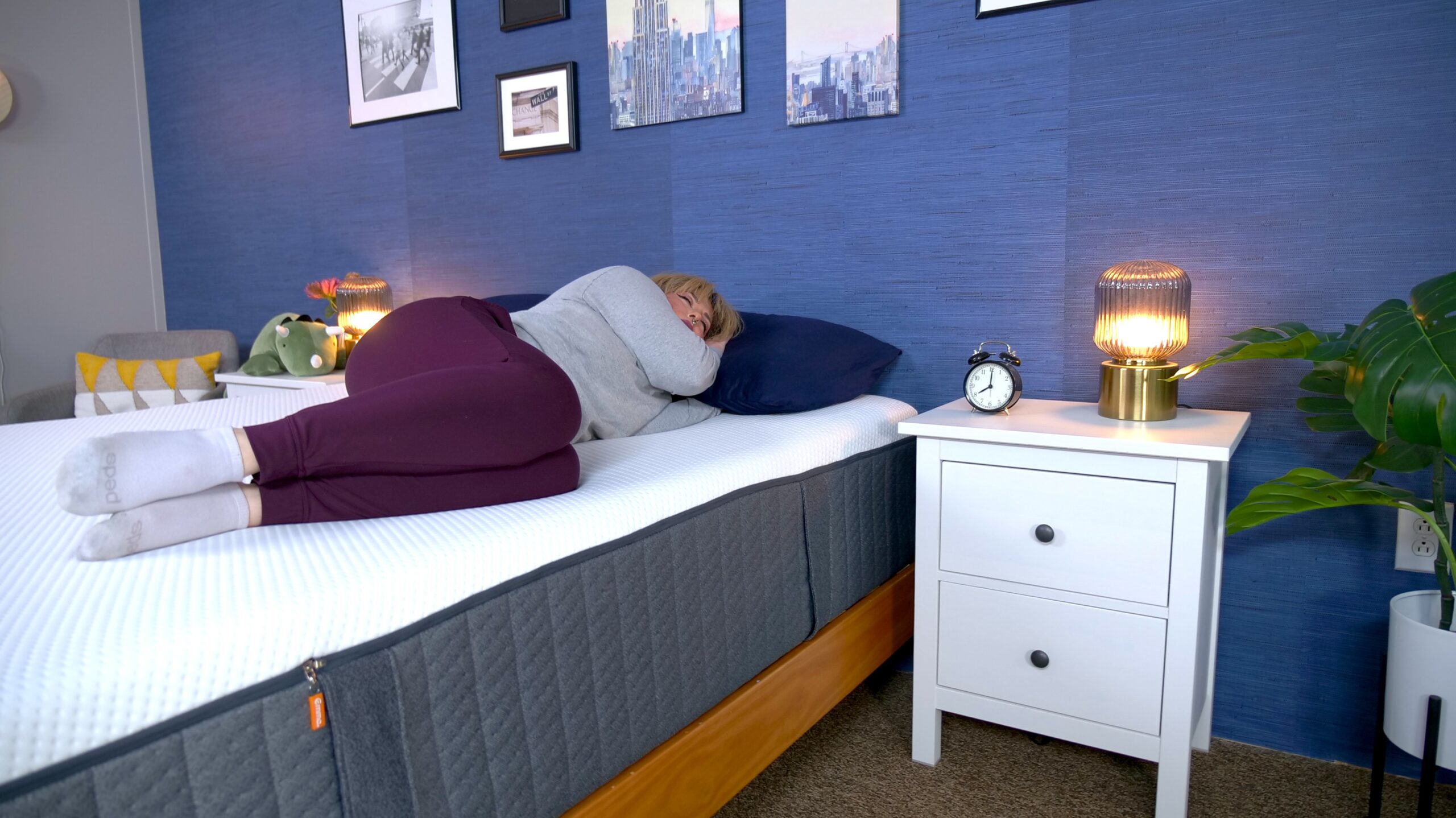Nichole side sleeping on the Emma Hybrid Cooling Elite mattress