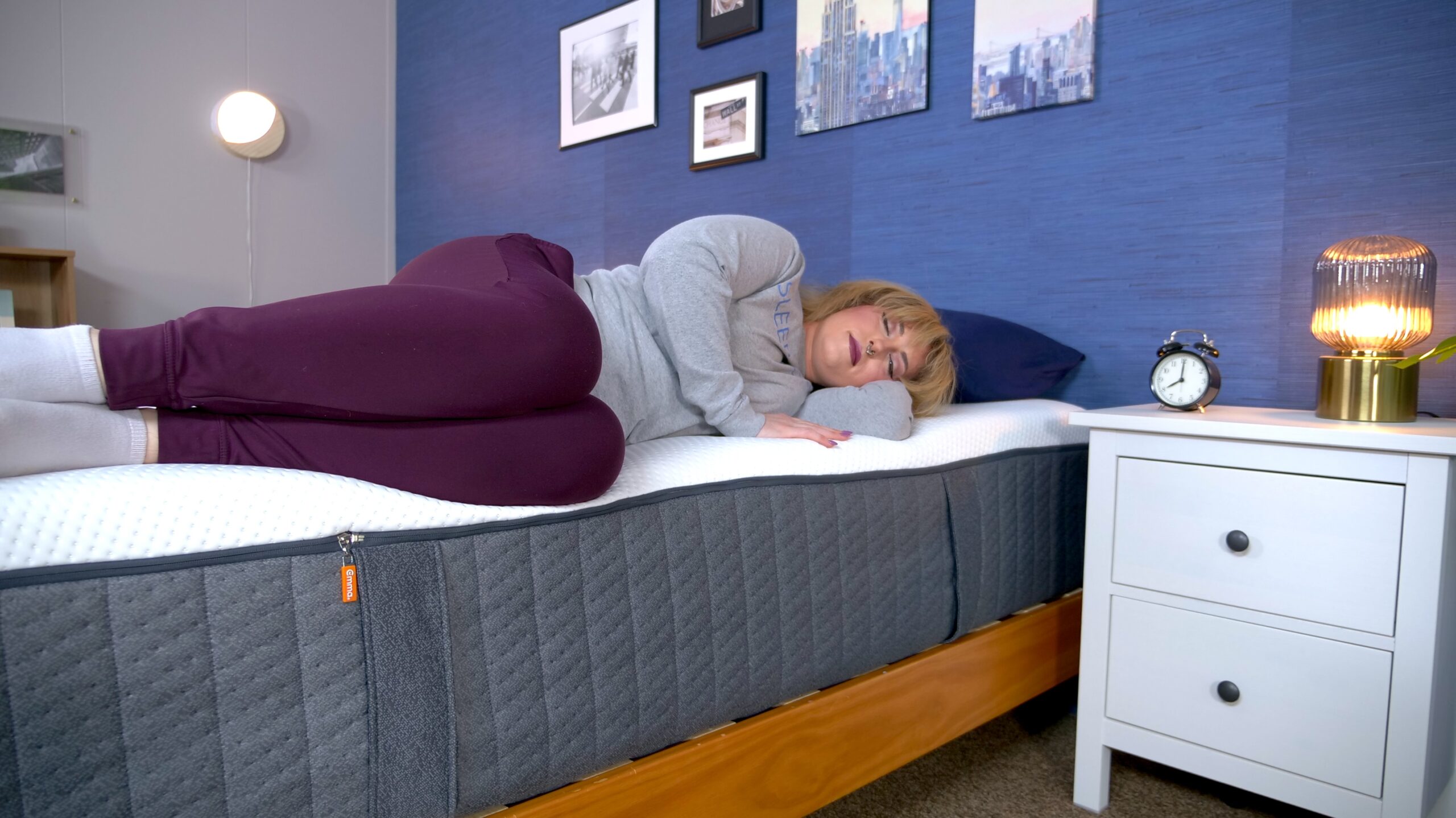 Nichole testing the edge support on the Emma Hybrid Cooling Elite mattress