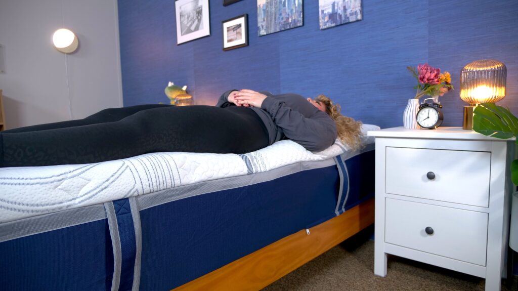 Nichole testing edge support on the Novaform ComfortGrande Advanced Gel Memory Foam Mattress