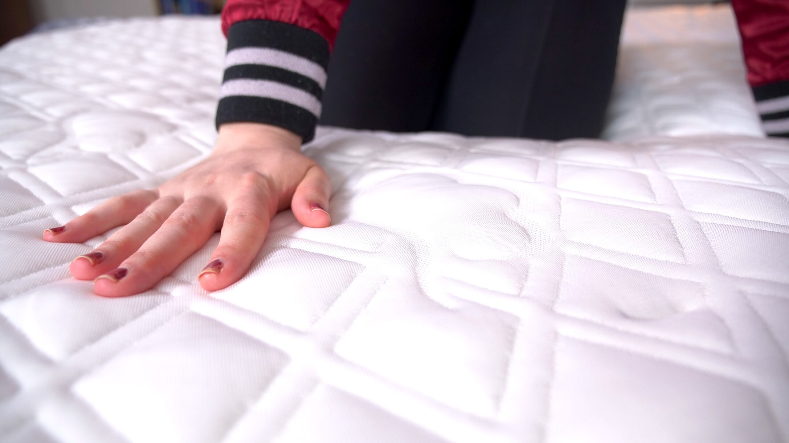 Nichole feeling the cloud cover on the Puffy Lux Hybrid Mattress