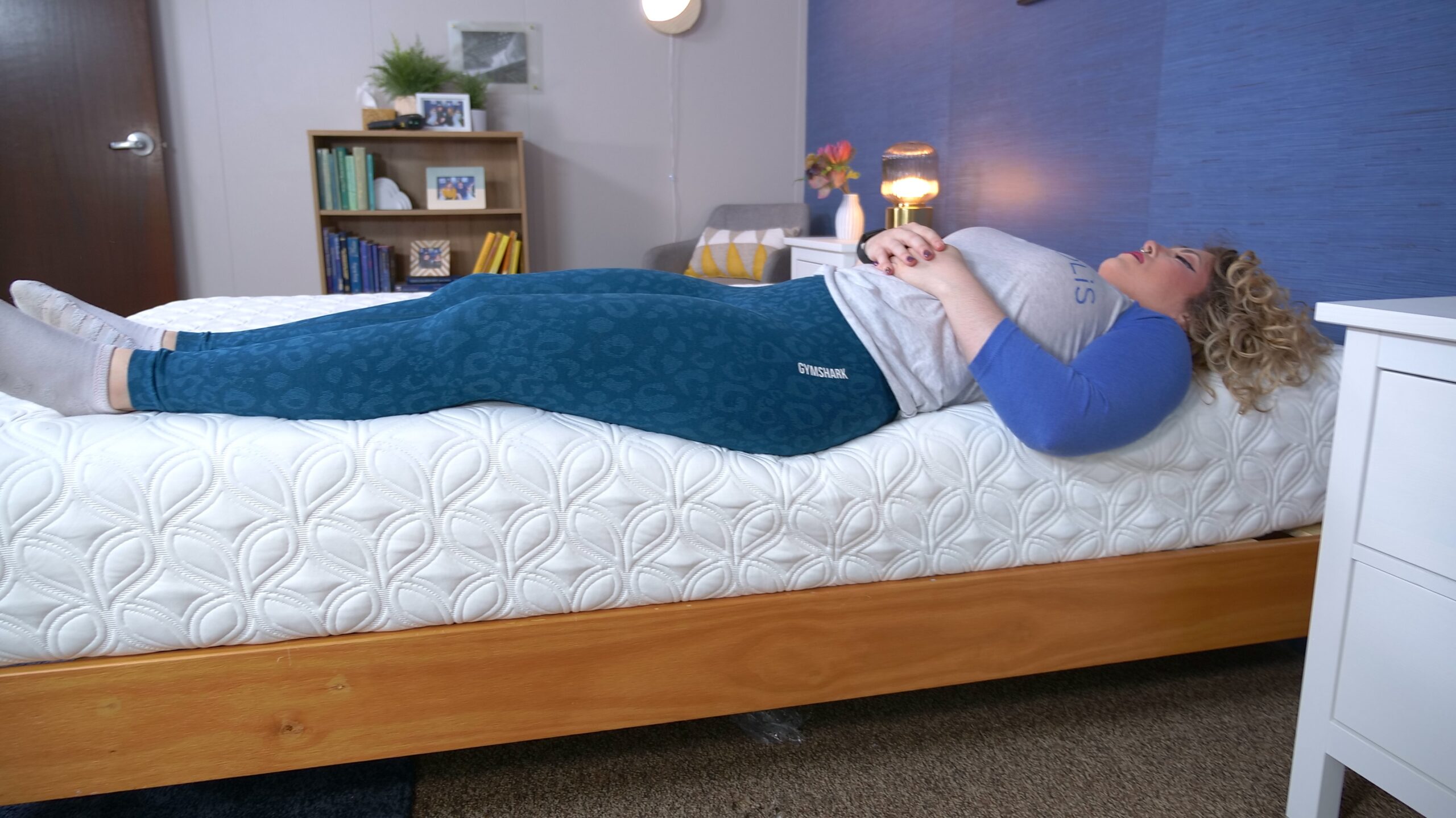 Nichole doing the edge support test on the Cocoon Chill Mattress Construction