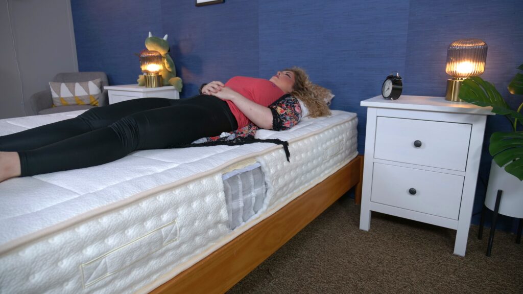 Nichole back sleeping on the Awara Natural Luxury Hybrid mattress.