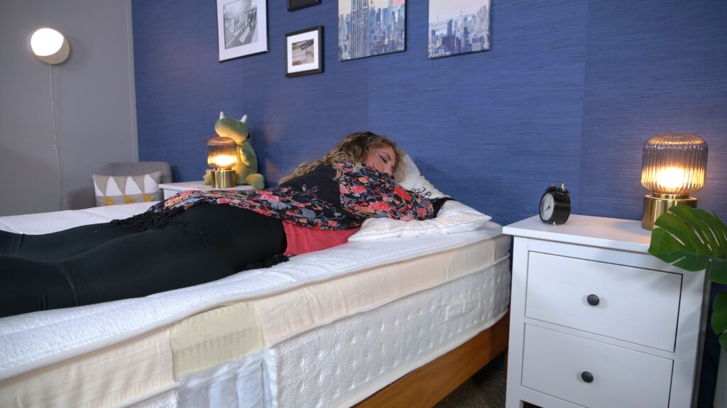 Nichole stomach sleeping on the Awara Premier Luxury Hybrid mattress.