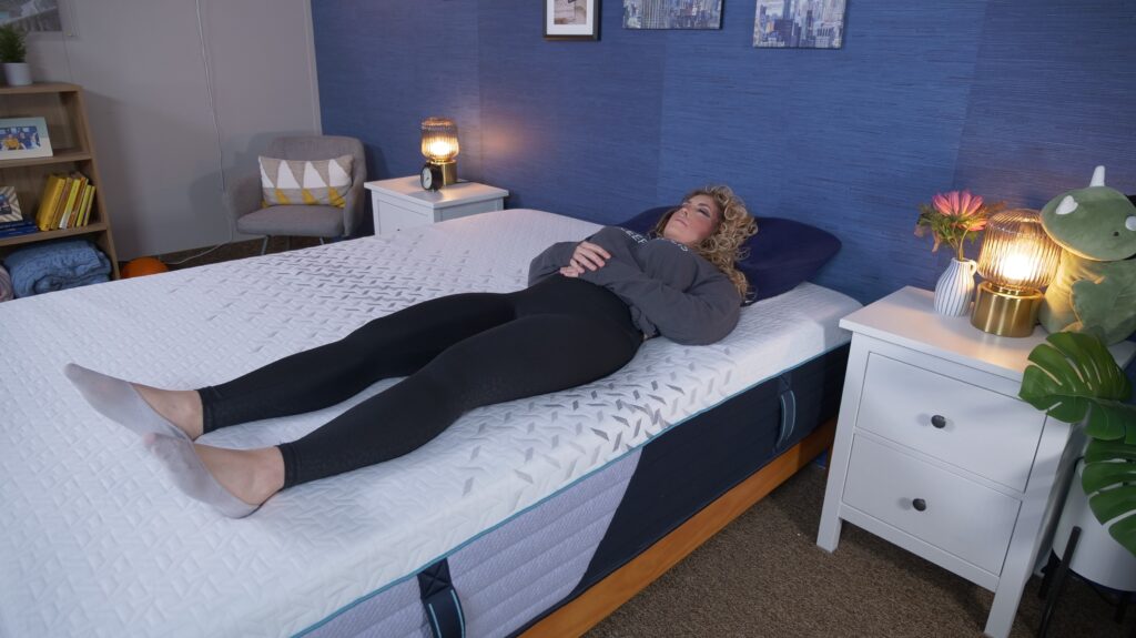 Nichole back sleeping on the Nectar Premier Hybrid mattress.