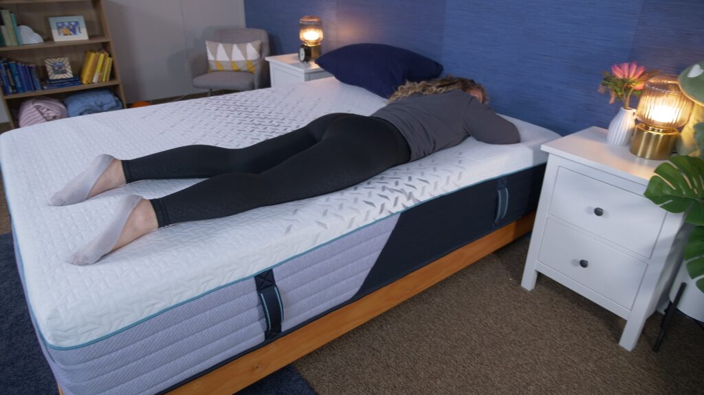 Nichole stomach sleeping on the Nectar Premier Hybrid mattress.