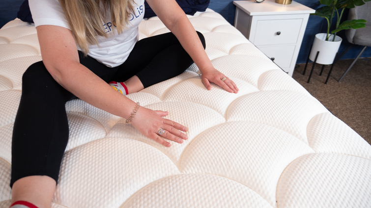 Feeling the material on the DreamCloud mattress.