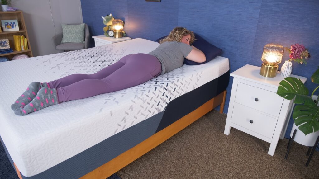 Nichole stomach sleeping on the Nectar Ultra mattress.