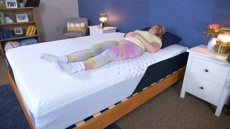 A person back sleeping on a Nectar Classic mattress.