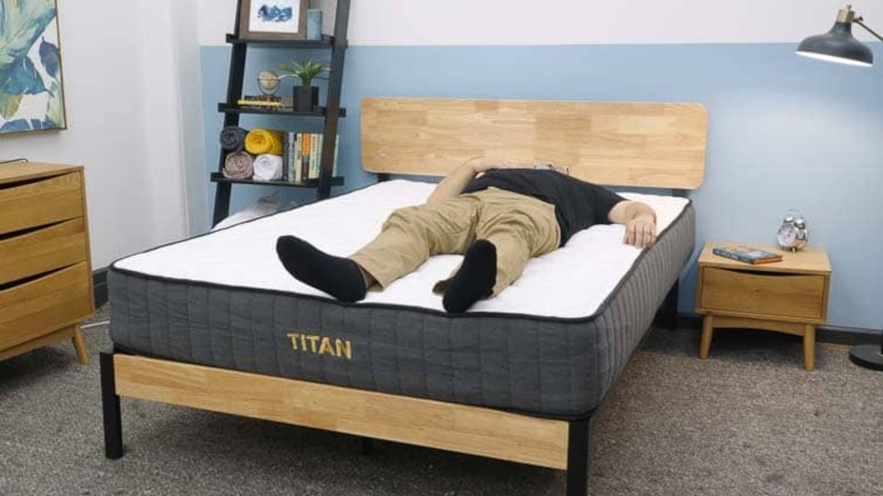 A heavier person back sleeping on the Titan Plus mattress by Brooklyn Bedding.