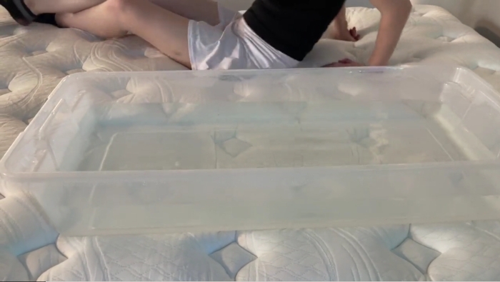 Our tester performs the ripple test on a Wolf Mattress.