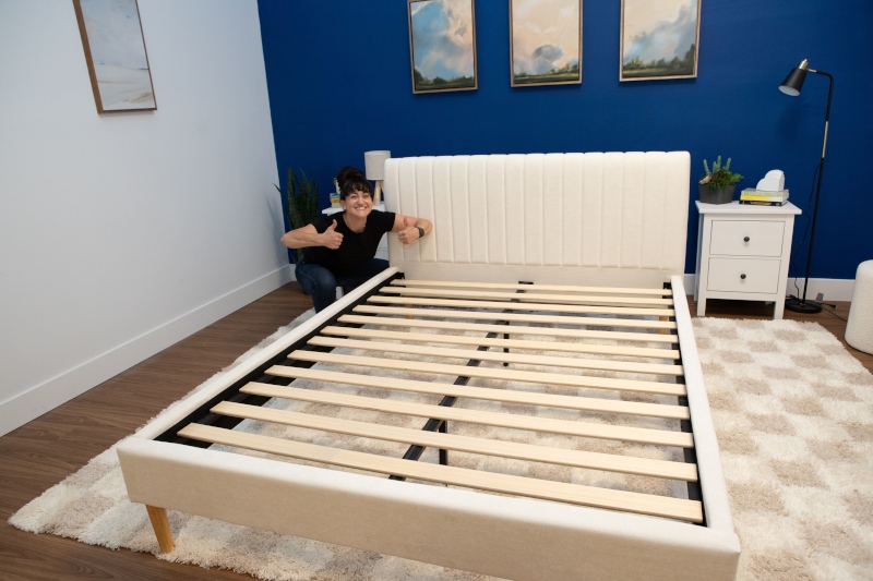 Kate finishes building the DreamLloud Claremont bed frame.
