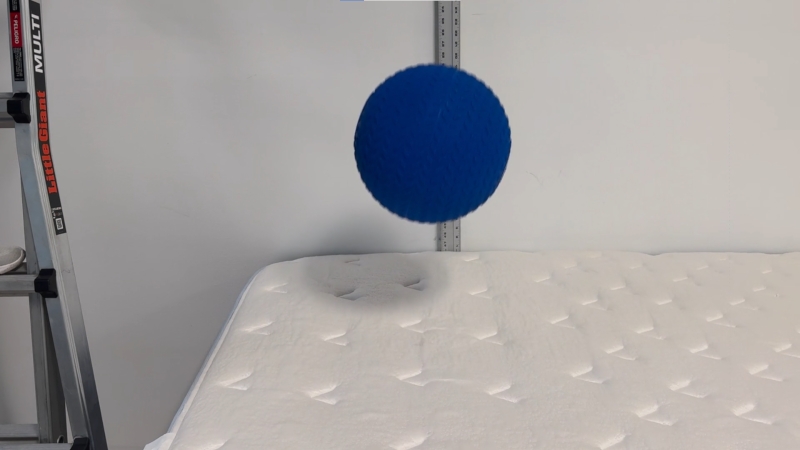 Our tester performs a bounce test on the Glacier Summit Hybrid Mattress